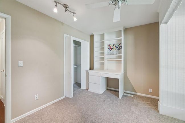 Unfurnished bedroom with light carpet, a closet, and a ceiling fan | Image 30