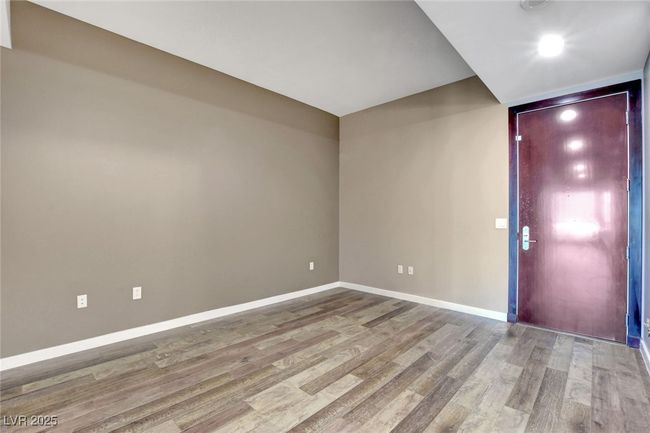 Den with baseboards and wood finished floors | Image 14