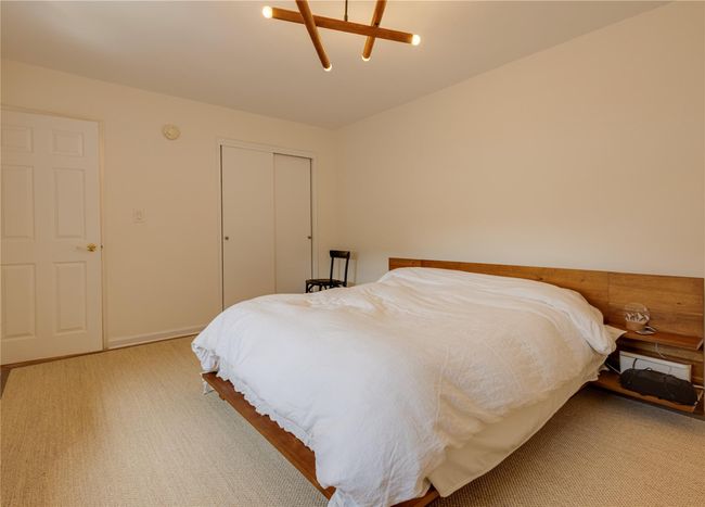 Carpeted bedroom featuring a closet, ceiling fan, and baseboards | Image 17