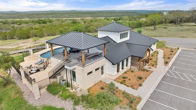 Aerial view of property and surrounding area featuring a heavily wooded area | Image 19