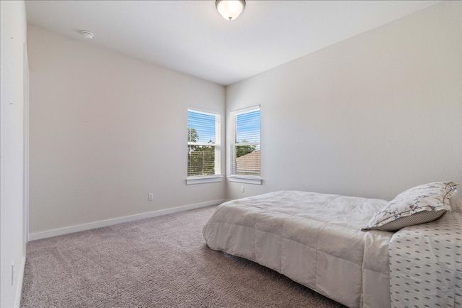 Bedroom featuring carpet flooring and baseboards | Image 31