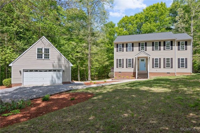 Colonial house with crawl space, a garage, and a front yard | Image 8