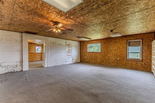 Spare room featuring carpet floors and a ceiling fan | Image 52