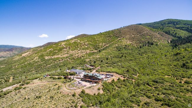 Birds eye view of property with a mountain view and a wooded view | Image 7