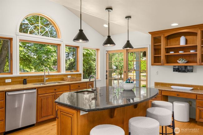 Prepare meals with a view—this kitchen offers front-row scenery of surrounding greenery. | Image 4