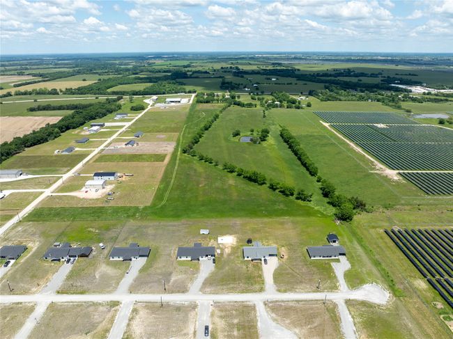 Overview of rural landscape featuring large plots for crops | Image 10