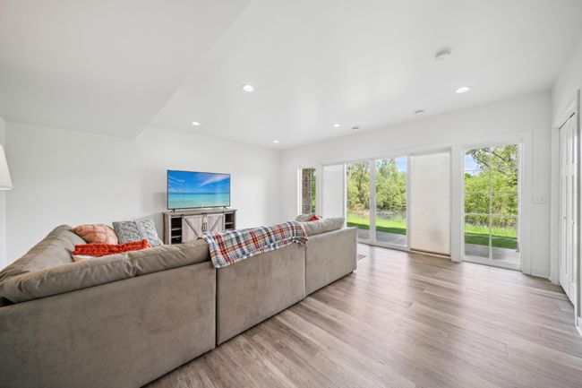 The walkout lower level provides a fantastic space perfect for entertaining guests or unwinding in comfort. | Image 33