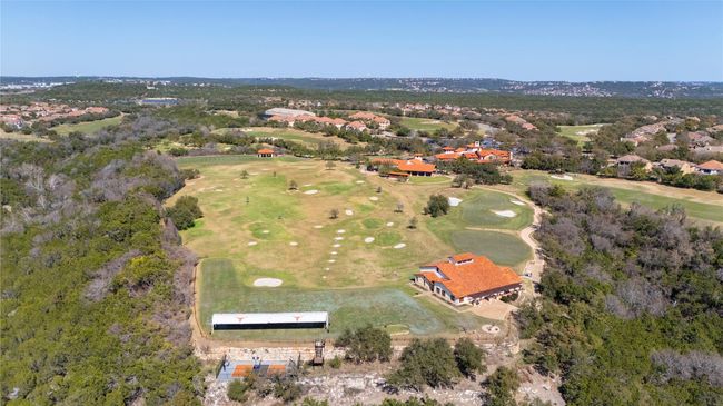 Aerial view of property and surrounding area featuring a golf club and nearby suburban area | Image 23