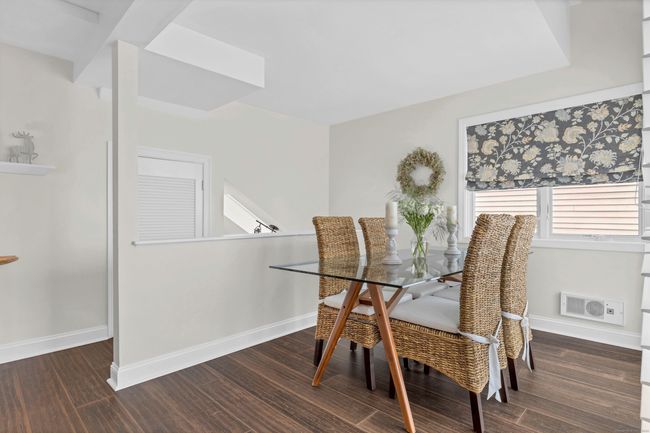 Dining room has sliders leading to the deck where you can enjoy your favorite beverage | Image 4