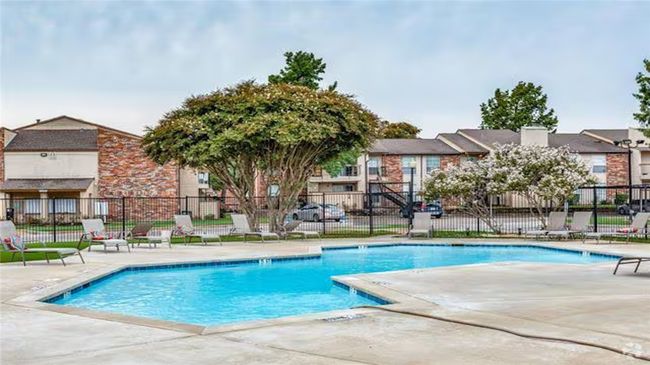 Community pool with a patio and a residential view | Image 19