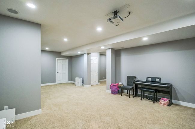 living area featuring carpet floors and recessed lighting | Image 28