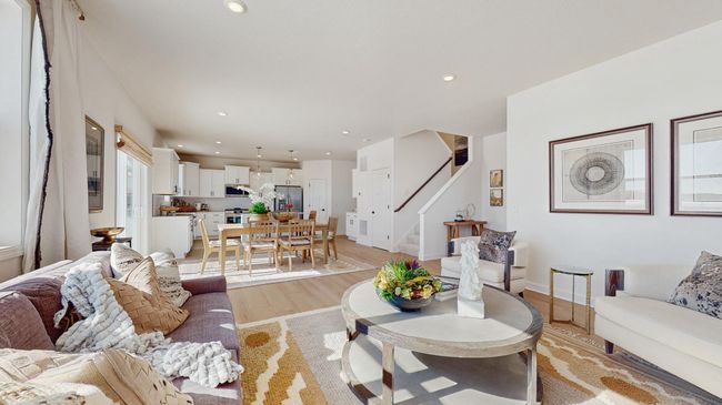 (Photo of a model home, actual features may vary) The main level seamlessly transitions from room to room while maintaining an open-concept layout throughout. | Image 8