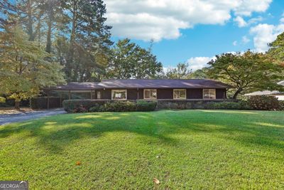 Explore the possibilities: Imagine this home with a fresh, lighter exterior in the next photo! | Image 1