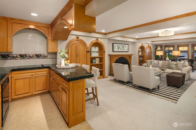 Downstairs rec room with kitchenette and adjacent media room. | Image 30