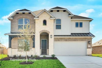 View of front facade with a garage | Image 1