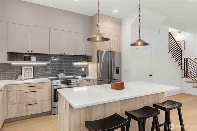 Enjoy morning coffee or summer barbeques on the patio with lush forest views. | Image 18