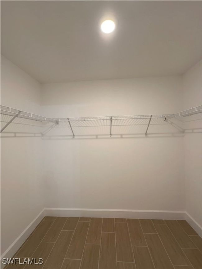 View of spacious closet | Image 13