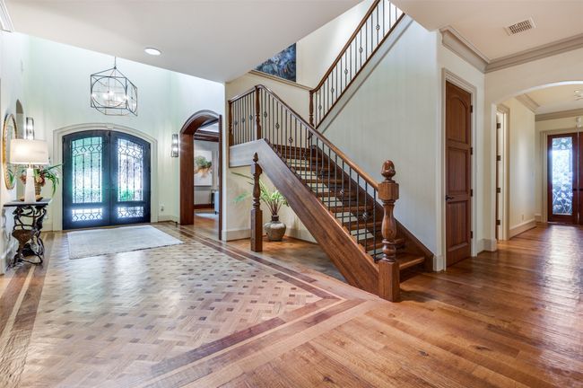 View of Entry Hall and stairs to second level | Image 25