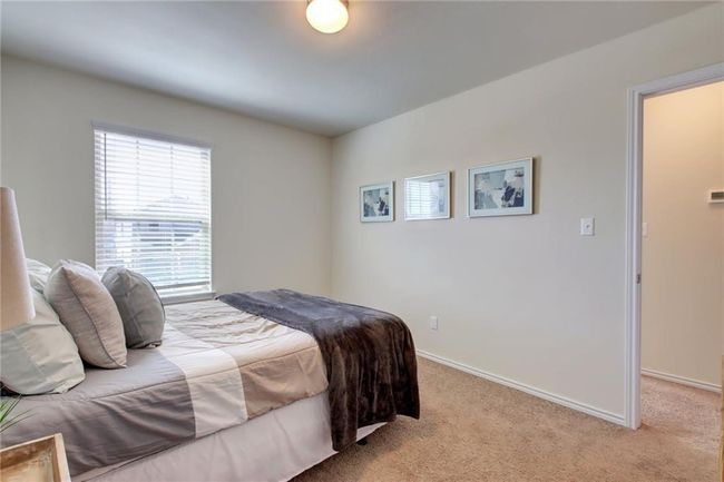 Bedroom featuring light colored carpet and baseboards | Image 26
