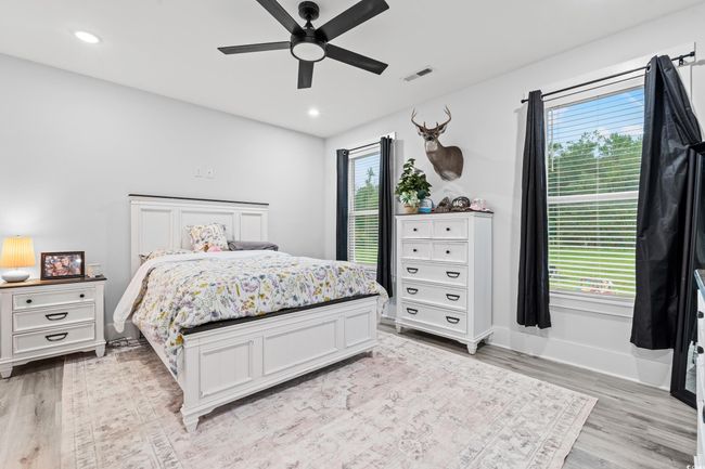 Bedroom featuring light wood-style floors, recessed lighting, and ceiling fan | Image 17