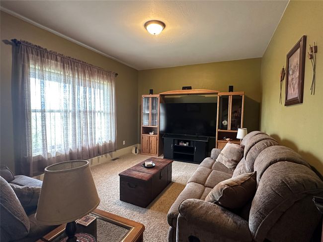 View of carpeted living area | Image 10