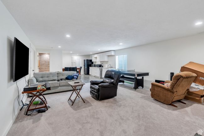 Living area with recessed lighting and light colored carpet | Image 14