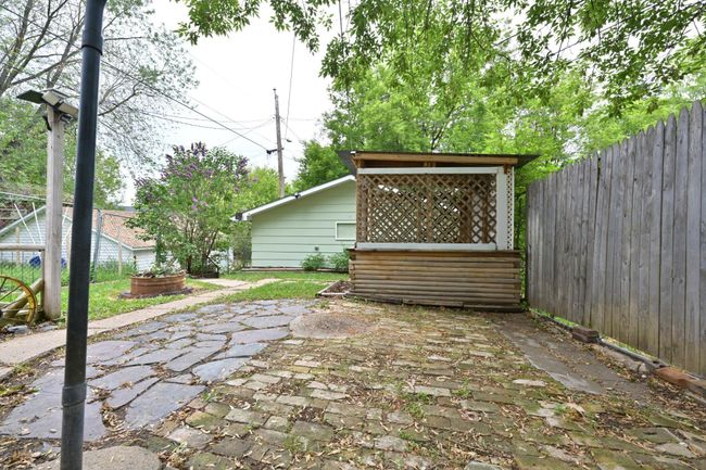 FENCED IN BACK PATIO TO GARAGE | Image 33