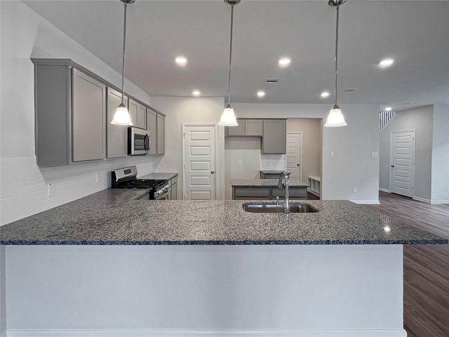 The Sparrow II- Kitchen. Home under construction. Sample floor plan photo used for illustrative purposes only. Upgrades, selections options, windows and colors may vary. | Image 7