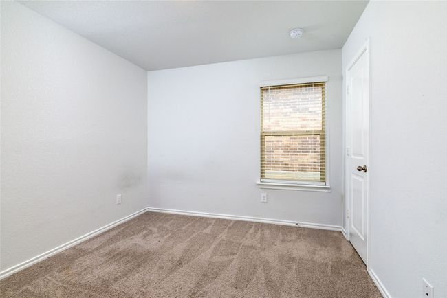 Carpeted spare room with a smoke detector and baseboards | Image 28