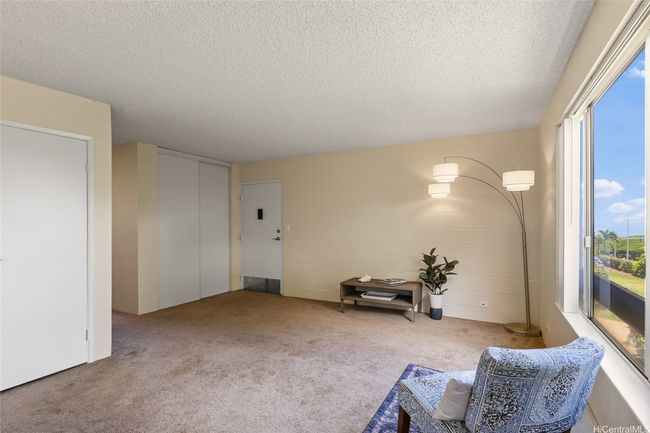 Living area with ocean views. Freshly painted through out he unit. New closet doors on storage area behind the front door | Image 6