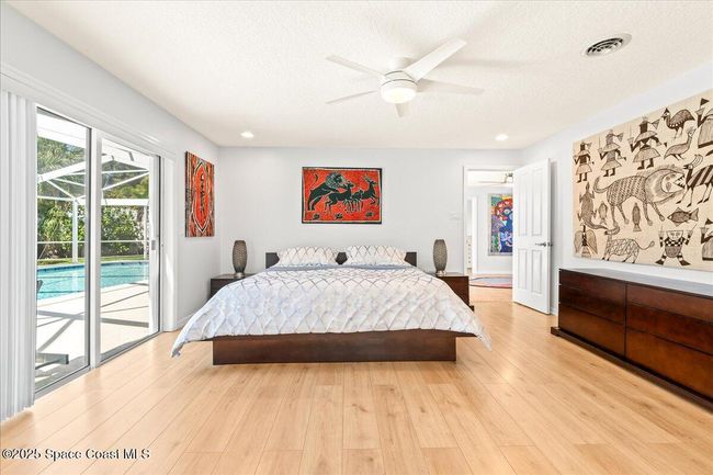 The Primary Bedroom Suite opens onto the Lanai, Pool, River Gazebo, and Dock | Image 30