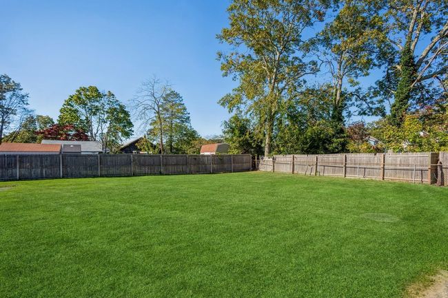 View of yard featuring a fenced backyard | Image 16