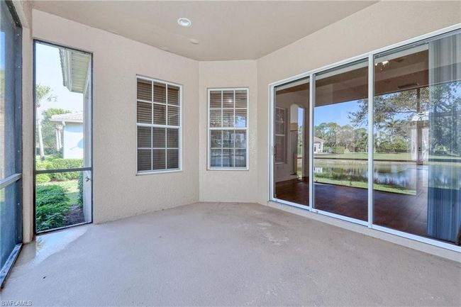 Unfurnished sunroom with a water view | Image 39