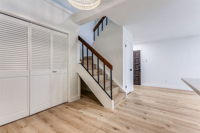 Dining area and stairway to loft | Image 11