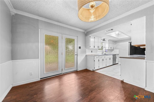 Dining view to back door and kitchen | Image 6