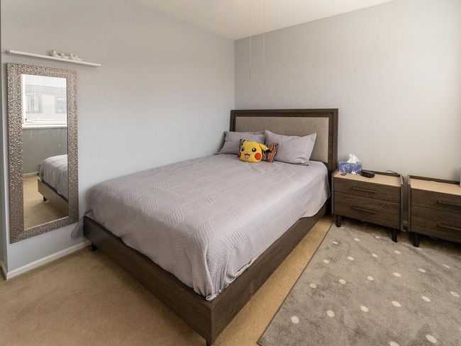 Bedroom with carpet floors | Image 18