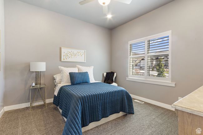 Bedroom featuring carpet, visible vents, baseboards, and ceiling fan | Image 17