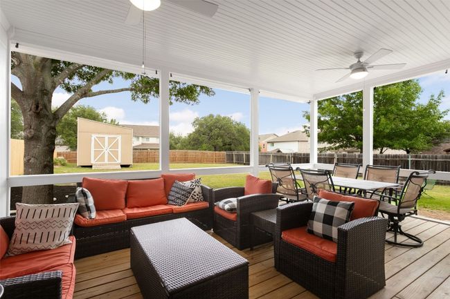 Discover your dream outdoor oasis! This stunning wooden terrace invites you to unwind with the gentle breeze from the ceiling fan, perfect for those warm summer evenings. Enjoy al fresco dining with family and friends in the spacious outdoor dining area, or relax and socialize in the inviting hangout spot. Experience luxury living outdoors, where every moment feels like a vacation! Don't miss out on this incredible opportunity to elevate your lifestyle! | Image 33