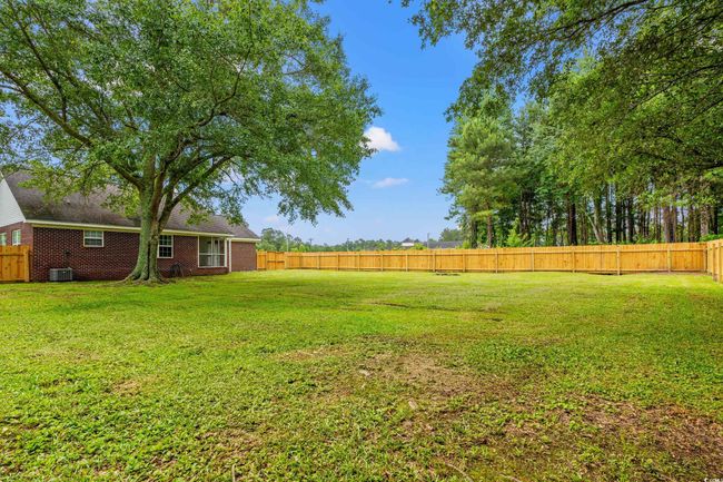 View of fenced backyard | Image 33