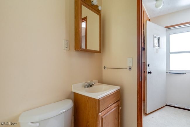 Half bathroom with toilet and vanity | Image 18