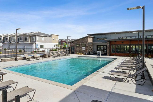 Community pool featuring a residential view, fence, and a patio area | Image 4