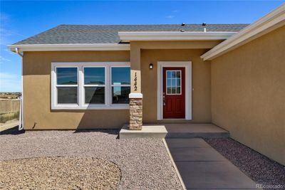 These pictures showcase a previously constructed house that shares the exact same floor plan and color palette as the one currently being built. | Image 2