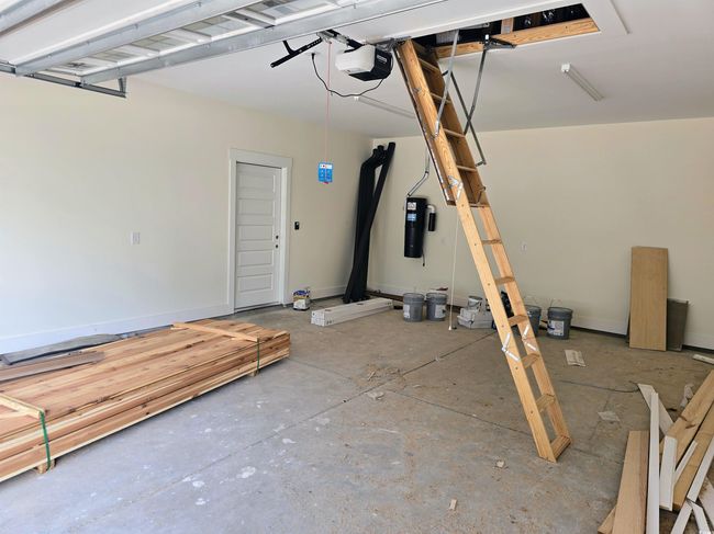 Garage with a garage door opener and a central vacuum unit | Image 29