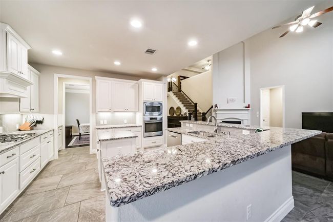 View of the kitchen space from the breakfast area. | Image 11