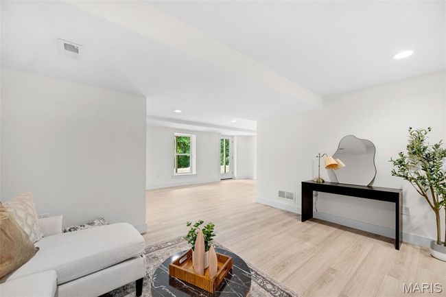 Living room with light wood-type flooring and recessed lighting | Image 35