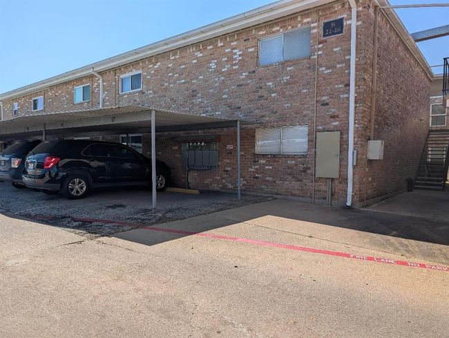 Car ports. Stairs on the right lead to the unit. | Image 24