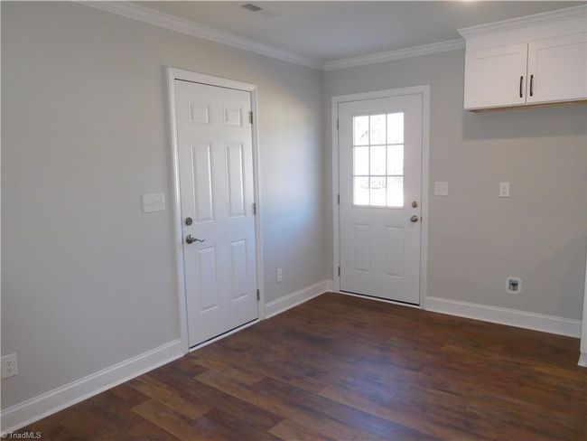 Dining Room. One Door leads in from the Garage and one door leads out to the Patio. Never get wet bringing your groceries in. | Image 6