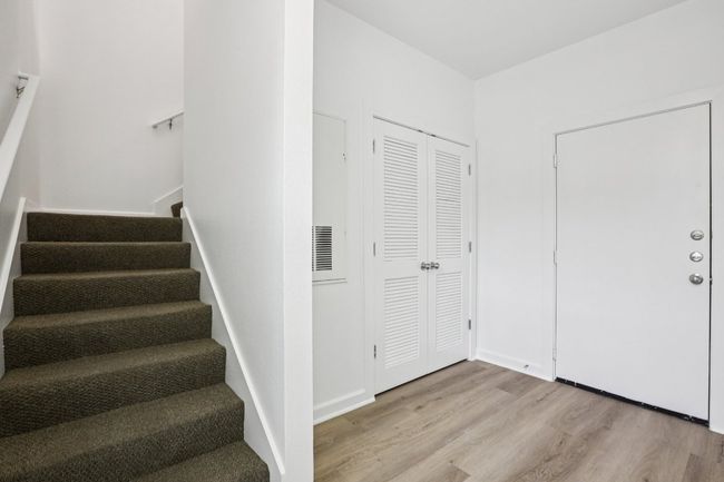 Foyer that leads to the rest of the living space upstairs. | Image 4