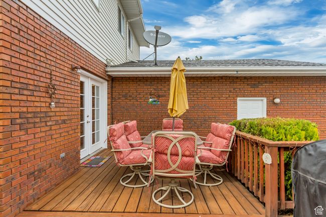 Deck with outdoor dining area, area for grilling, and french doors | Image 7