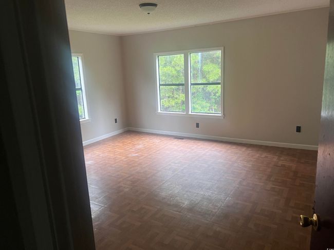 Bathroom with baseboards, toilet, and wood finished floors | Image 18